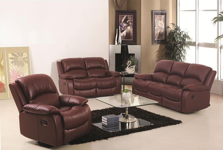 a set of maroon leather lounges